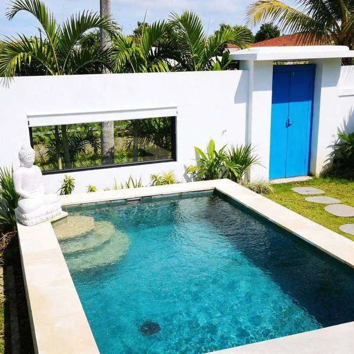 Villa Sayan 3 pool side view with Buddha and blue door