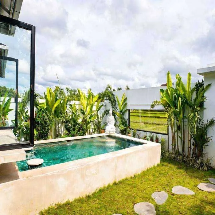 Villa Sayan 3 pool with Buddha statue and rice field views