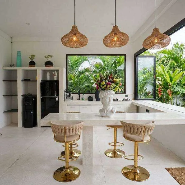 Villa Sayan 3 kitchen with rattan pendants and bar seating
