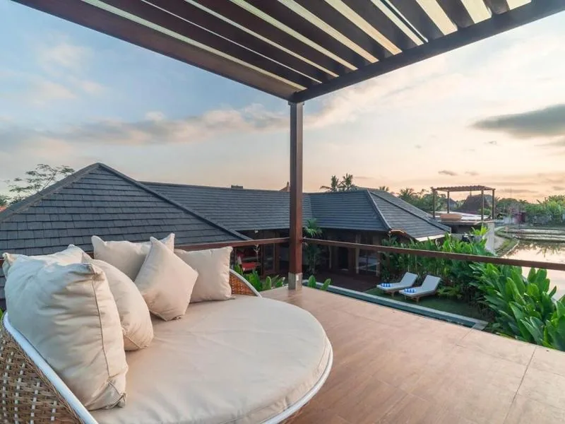 Pergola lounge with sunset rice field view