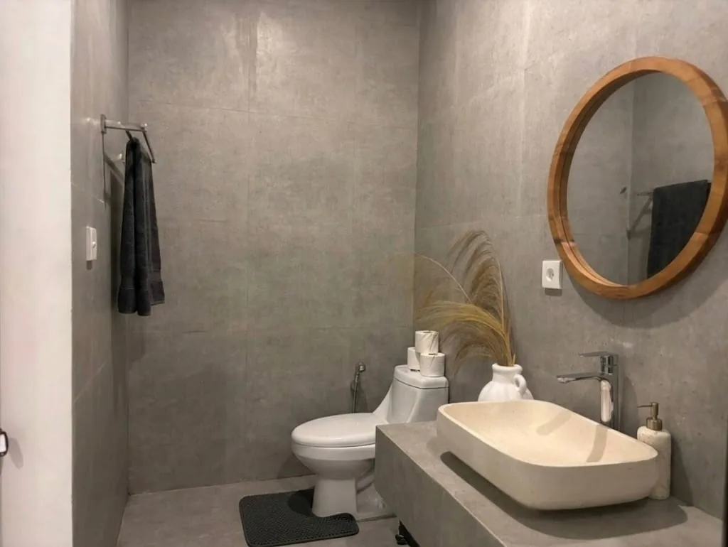 Petitenget Tiny House bathroom with stone vessel sink and walk-in shower
