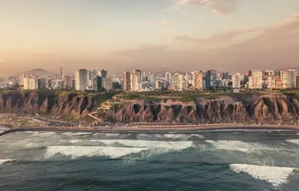 Uluwatu cliffs with crashing waves at sunset