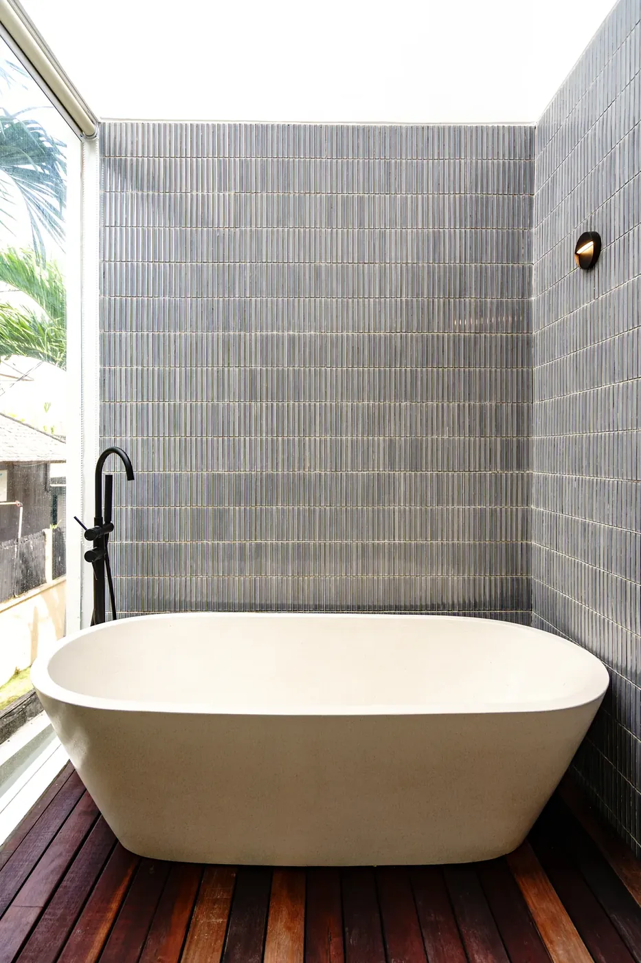Villa Oasis bathroom with sculptural freestanding stone tub