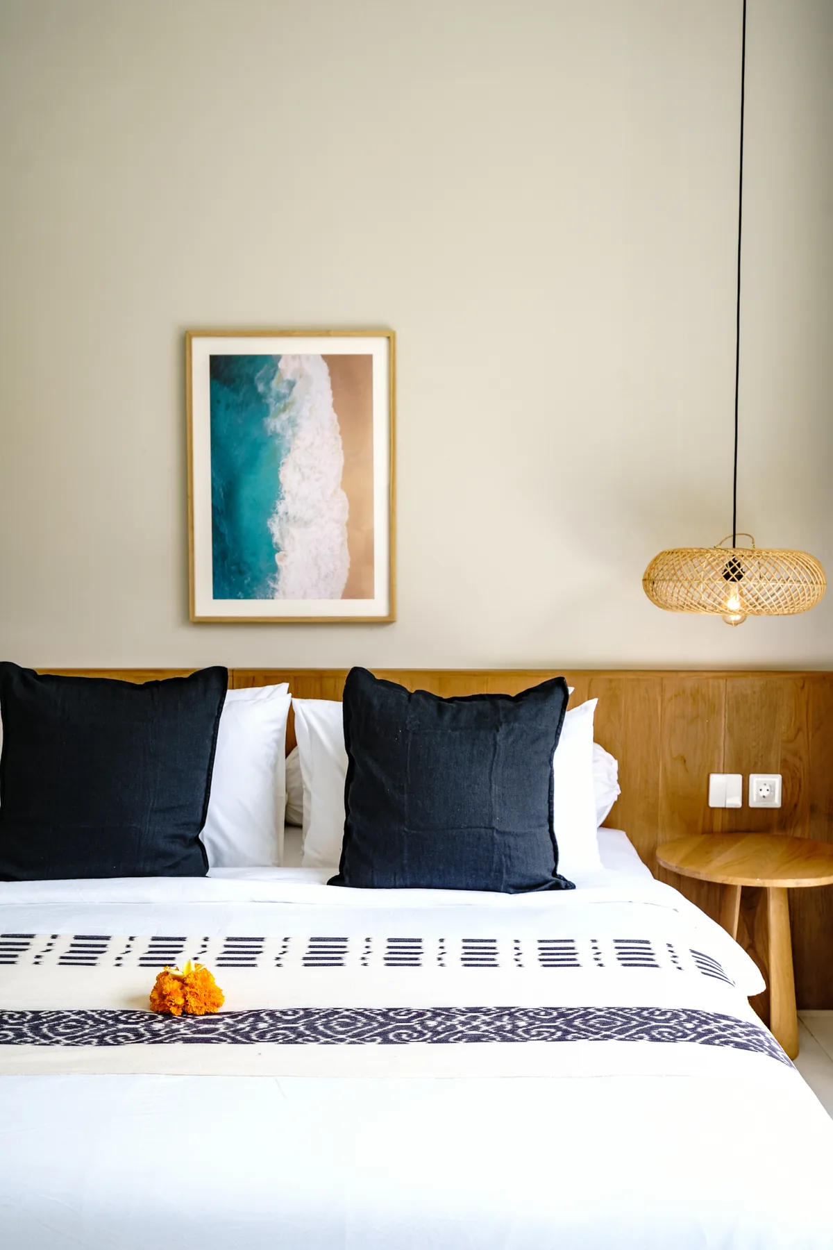 Villa Oasis garden-view double bedroom with coastal artwork