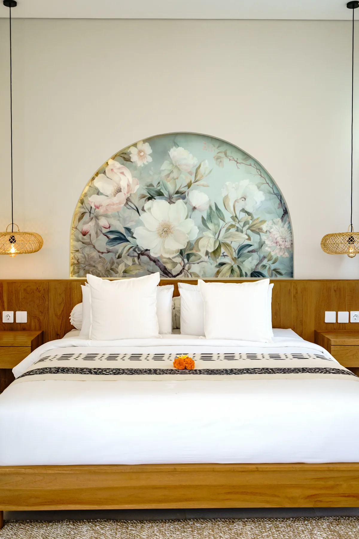 Villa Oasis master suite with back-lit floral-mural headboard